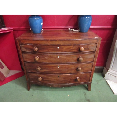 4112 - An 18th Century George III mahogany bow front chest of four long graduated drawers, with cross-bande... 