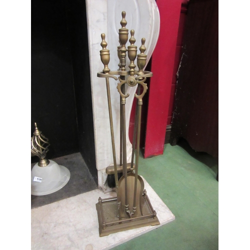 4119 - A brass fireplace companion set on stand