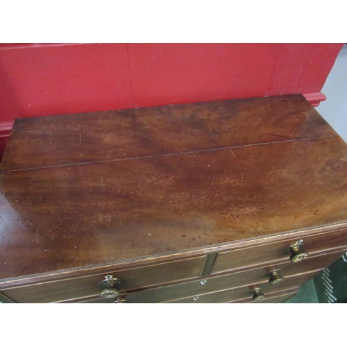 4123 - A George III mahogany straight front chest of two short over three long drawers, with repousse brass... 