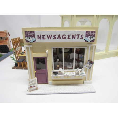 5043 - A dolls house model conservatory, 39cm tall x 32cm wide x 29.5cm deep. Together with a diorama of ne... 