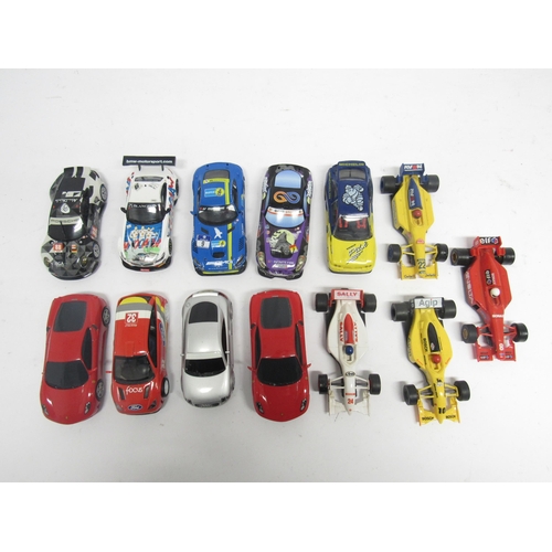 5074 - Thirteen loose Hornby Scalextric slot racing cars and a quantity of track and accessories