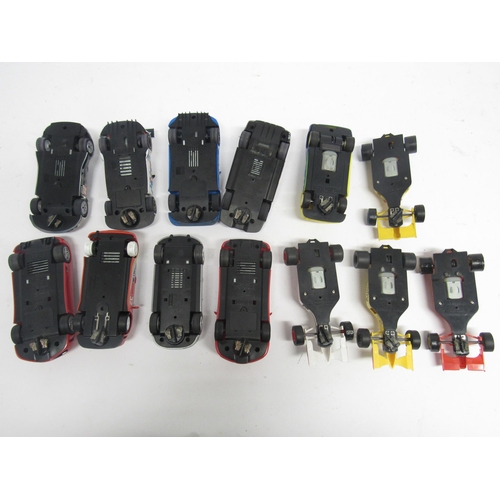 5074 - Thirteen loose Hornby Scalextric slot racing cars and a quantity of track and accessories