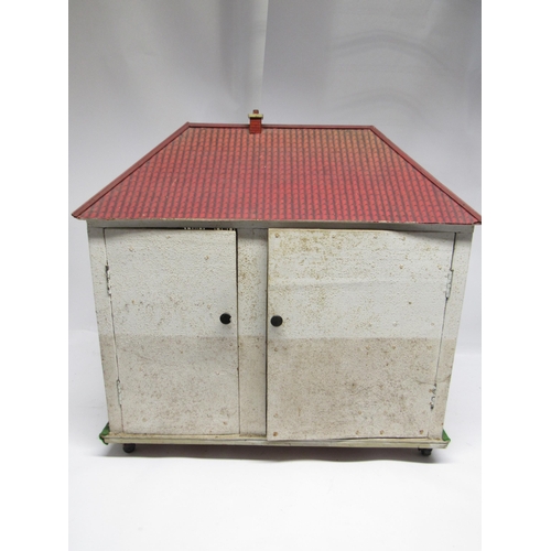 5042 - A mid 20th Century rear opening two-storey dolls house in the manner of Triang, with tinplate chiney... 