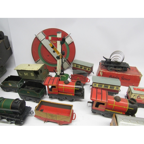 5134 - A collection of playworn 0 gauge model railway rolling stock and accessories including Hornby LMS 0-... 