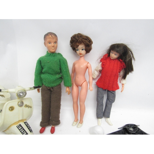 5058 - A vintage Pedigree Sindy doll, Paul doll and a Uneeda fashion doll, with an assortment of official a... 