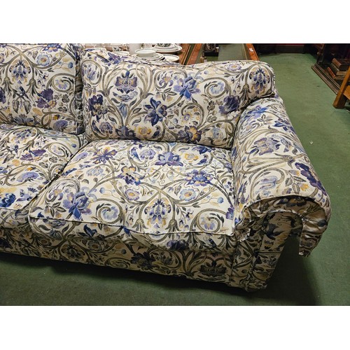 4125 - A Multiyork large two seater sofa with blue floral design including feather cushions. Approx. 87cm h... 