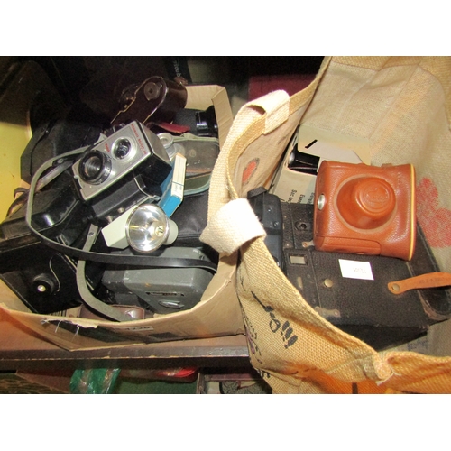 4228 - A box and a bag containing a collection of 35mm & box cameras w/ accessories