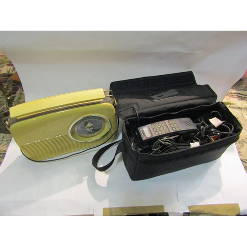 4229 - A Motorola 4800X cased mobile phone unit with battery together with a Bush radio