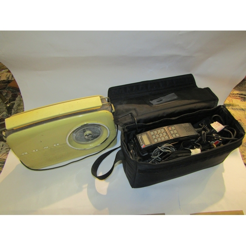 4229 - A Motorola 4800X cased mobile phone unit with battery together with a Bush radio