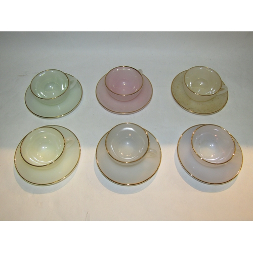 4320 - A set of six Arcopal Paris coloured glass teacups and saucers and an RKG Czech part tea set, one cup... 