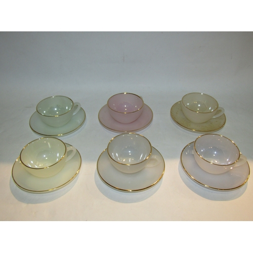 4320 - A set of six Arcopal Paris coloured glass teacups and saucers and an RKG Czech part tea set, one cup... 