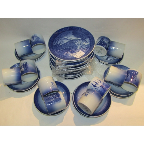 4322 - A quantity of Royal Copenhagen Christmas pattern plates, cups and saucers, blue and white