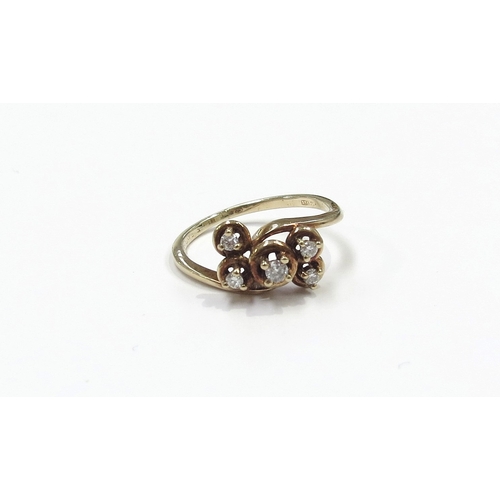 6197 - A 9ct gold ring set with five small diamonds in irregular height settings. Size J, 1.7g