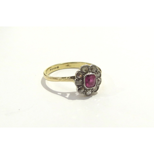 6175 - An 18ct gold ruby and diamond cluster ring. Size K, 2g