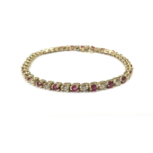 6319 - A yellow gold ruby and diamond line bracelet, 3.22ct approx ruby total, 1.84ct approx diamond total,... 