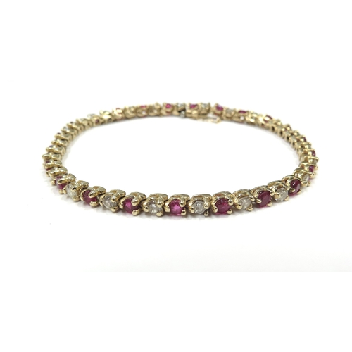 6319 - A yellow gold ruby and diamond line bracelet, 3.22ct approx ruby total, 1.84ct approx diamond total,... 