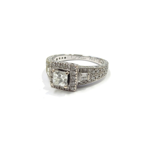 6255 - A 14ct white gold diamond cluster ring the central princess cut diamond 0.38ct framed by diamonds wi... 