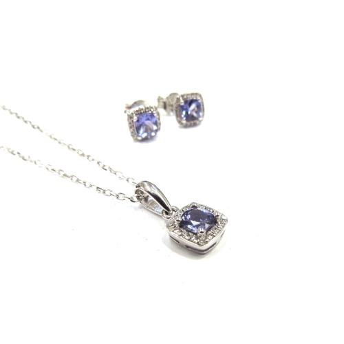 6296 - A 9ct white gold chain 46cm long hung with a tanzanite and diamond cluster pendant with a pair of ma... 