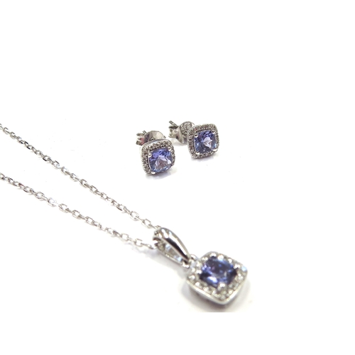 6296 - A 9ct white gold chain 46cm long hung with a tanzanite and diamond cluster pendant with a pair of ma... 