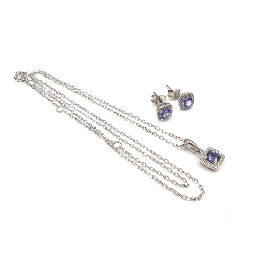 6296 - A 9ct white gold chain 46cm long hung with a tanzanite and diamond cluster pendant with a pair of ma... 