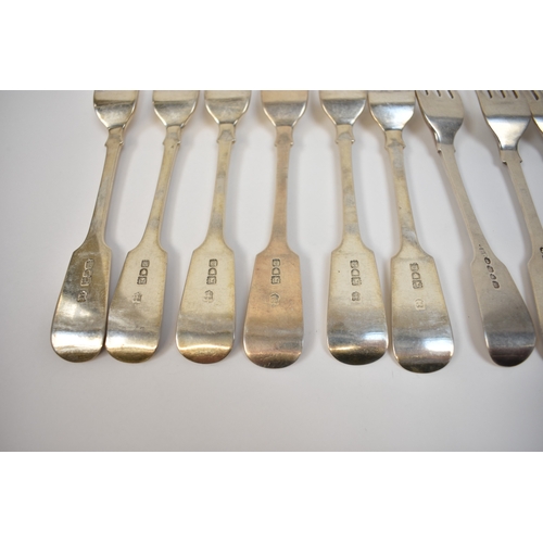 8151 - Twelve silver fiddle pattern forks, six by Josiah Williams & Co London 1902 with monogram to handle,... 