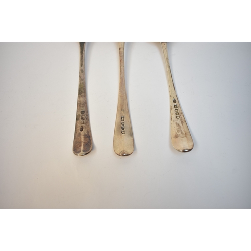 8144 - Three George III silver serving spoons, London 1782, 1788, 1790 all with crested handles, 180g