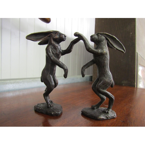 2077 - A pair of bronze boxing hares by David Meredith 10cm tall