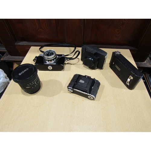 1404 - A mixed collection of 35mm & folding cameras, camera bags and accessories including a Sigma 17-35mm ... 