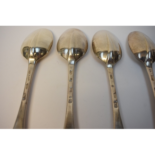 8128 - Four Britannia Standard George I rats tail silver serving spoons with Armorial crest depicting a shi... 