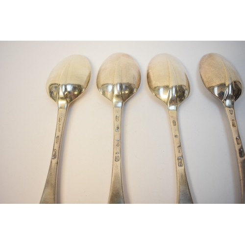 8128 - Four Britannia Standard George I rats tail silver serving spoons with Armorial crest depicting a shi... 