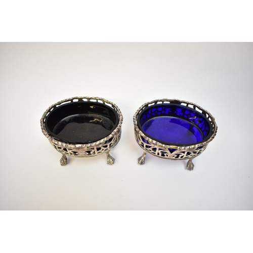 8089 - A pair of David Hennell I and Robert Hennell I pierced silver silver salts raised on four ball and c... 