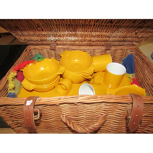 2301 - A wicker hamper stamped F & M containing Melaware picnic ware