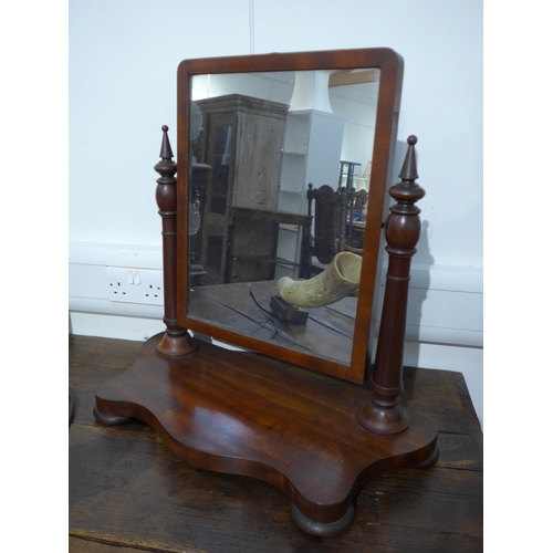 8492 - A 19th Century mahogany table top mirror with turned column finial supports, shaped base some veneer... 