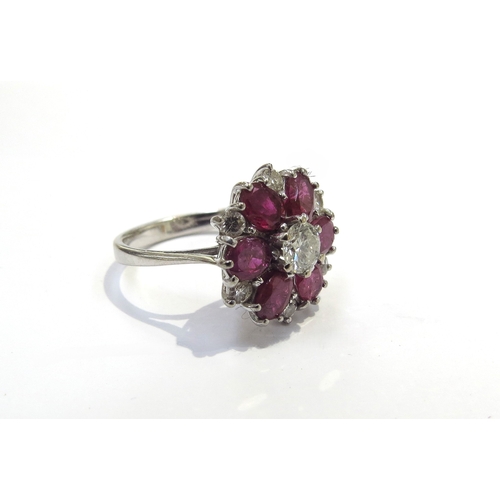 6171 - An 18ct white gold ruby and diamond cluster ring. Size L, 4.6g