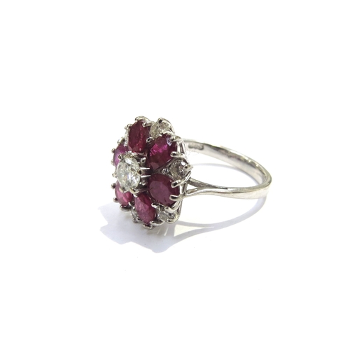 6171 - An 18ct white gold ruby and diamond cluster ring. Size L, 4.6g