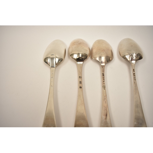 8134 - Four 18th Century silver Hanoverian spoons including fancy back and extended drop, one monogrammed w... 