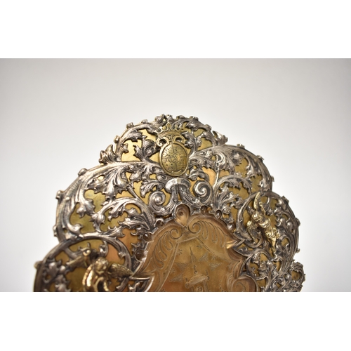 8079 - Possibly German a Holy water vessel, silver gilt cartouche shaped back with elaborate scrolling acan... 