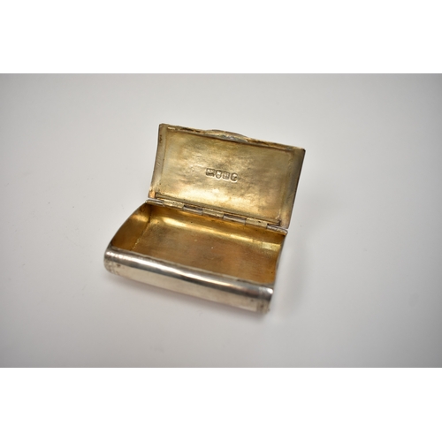 8029 - A Georgian white metal snuff box with spurious silver marks, the foliate engraved lid with central i... 