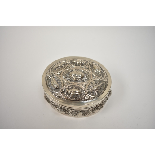 8032 - A white metal lidded trinket box, all-over repousse design of insects and creatures, 4cm tall x  8.7... 