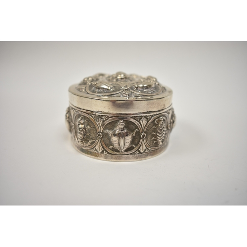 8032 - A white metal lidded trinket box, all-over repousse design of insects and creatures, 4cm tall x  8.7... 