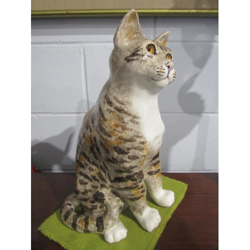 1007 - A large Winstanley seated cat with amber glass eyes, size 8, 41cm tall