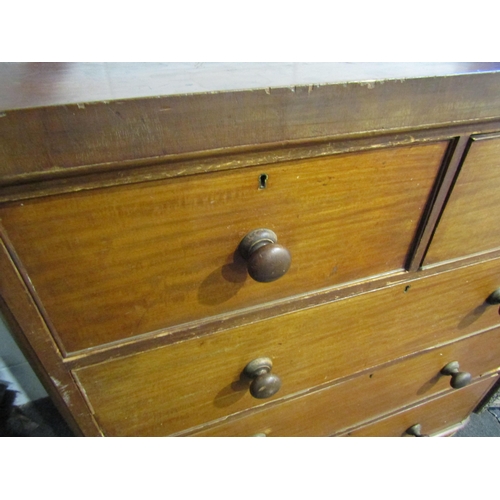 1010 - A 19th Century mahogany chest of two short over three long drawers with bun handles, a/f, 120cm tall... 