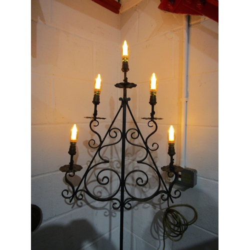 1012 - A wrought iron tiered standard lamp on scrolled tripod feet, 73cm tall