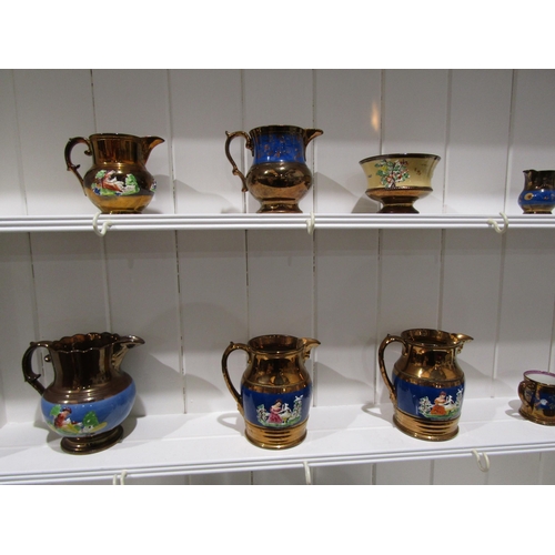 1034 - A collection of lustre ware, mostly jugs and cups (14 - two a/f)