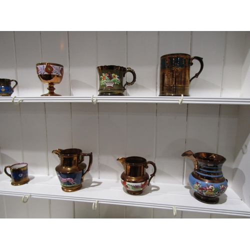 1034 - A collection of lustre ware, mostly jugs and cups (14 - two a/f)