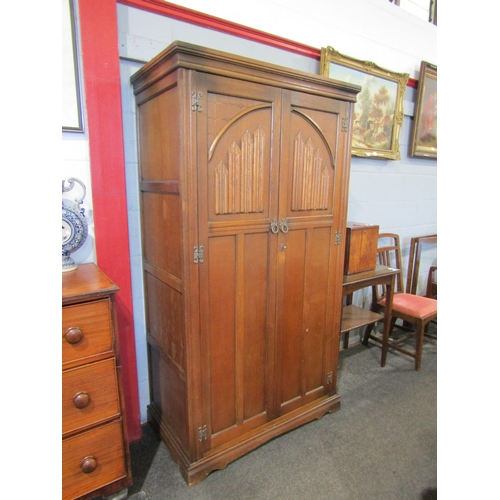 1078 - An early 20th Century Old Charm style oak wardrobe, linen fold detail to doors, with key, 175cm tall... 