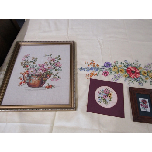 1085 - Two framed tapestries on linen depicting floral still-life, framed and glazed, together with three s... 