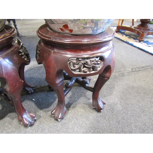 1094 - A pair of 20th Century Chinese ceramic goldfish bowls, 40cm diameter, with associated hardwood stand... 