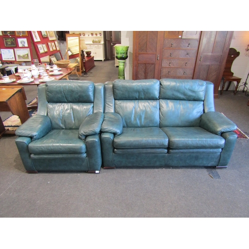 1108 - An emerald green leather two seater sofa and matching armchair