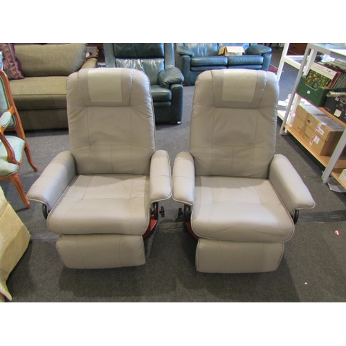 1109 - A pair of reclining swivel armchairs